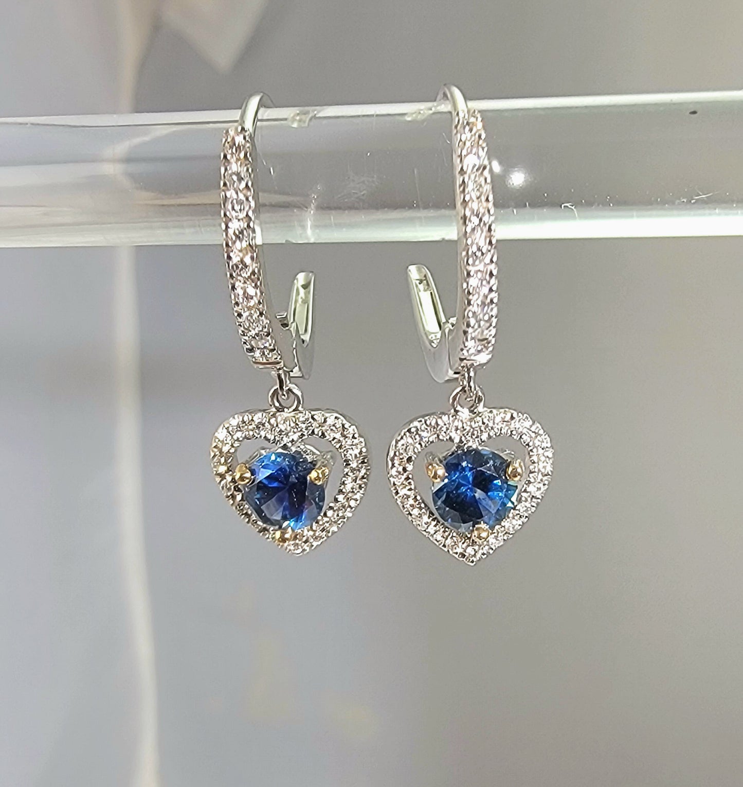 18k white gold diamond and Montana sapphire dangle heart earrings