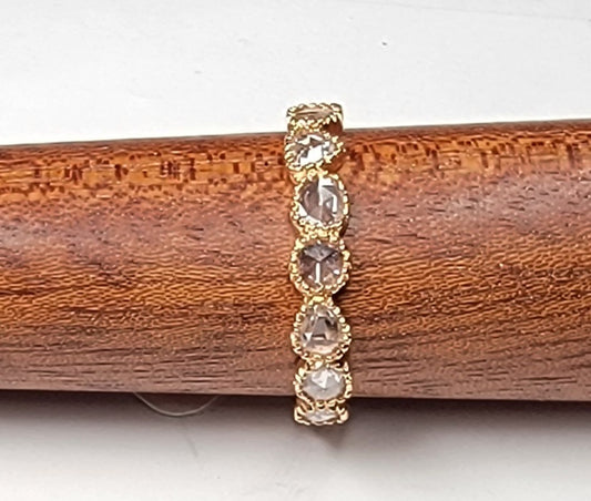 18k rose gold millgrain band with rose cut diamonds