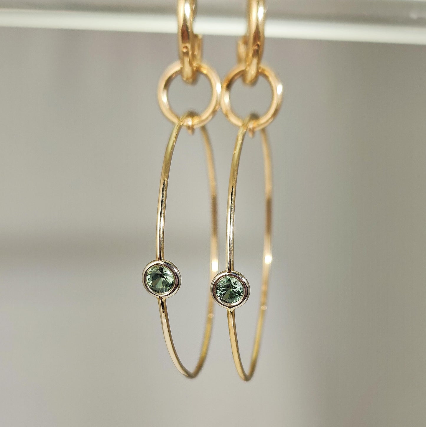 14k yellow gold one of a kind Montana sapphire hoops